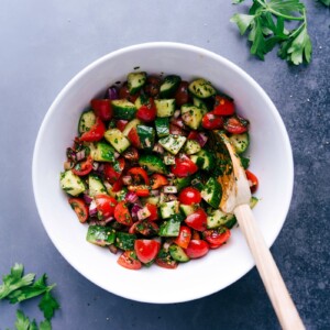 Fresh Israeli salad in a serving bowl with vibrant vegetables and herbs.