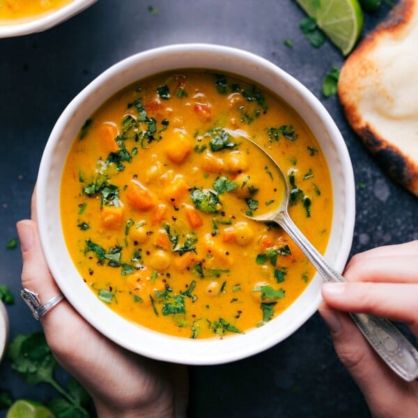 A bowl of warm sweet potato coconut curry soup, packed with flavor.