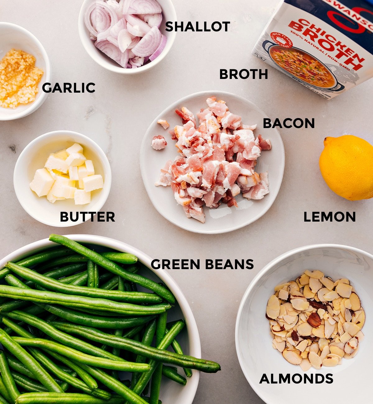 All the ingredients in this recipe—meat, veggies, butter, garlic, broth, lemon, and almonds—are prepped for easy assembly.