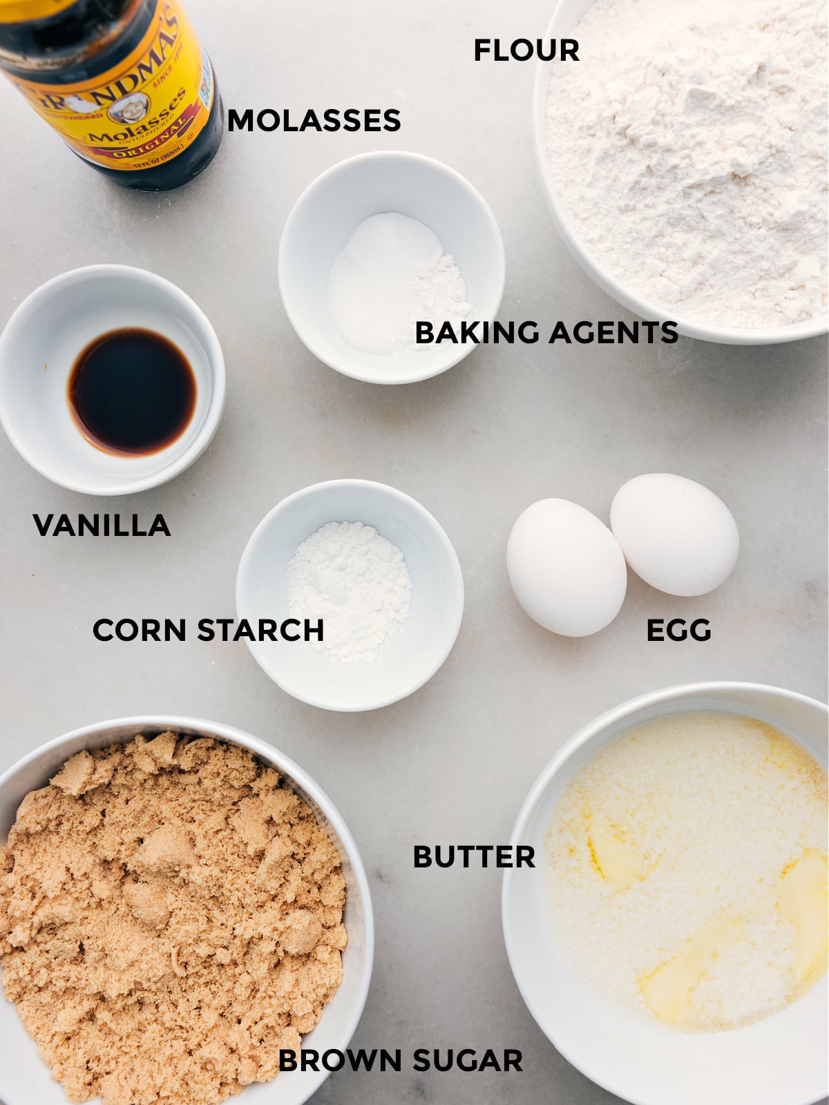 All the ingredients for this recipe, including eggs, cornstarch, butter, sugar, vanilla, and baking agents, are prepped for easy assembly.