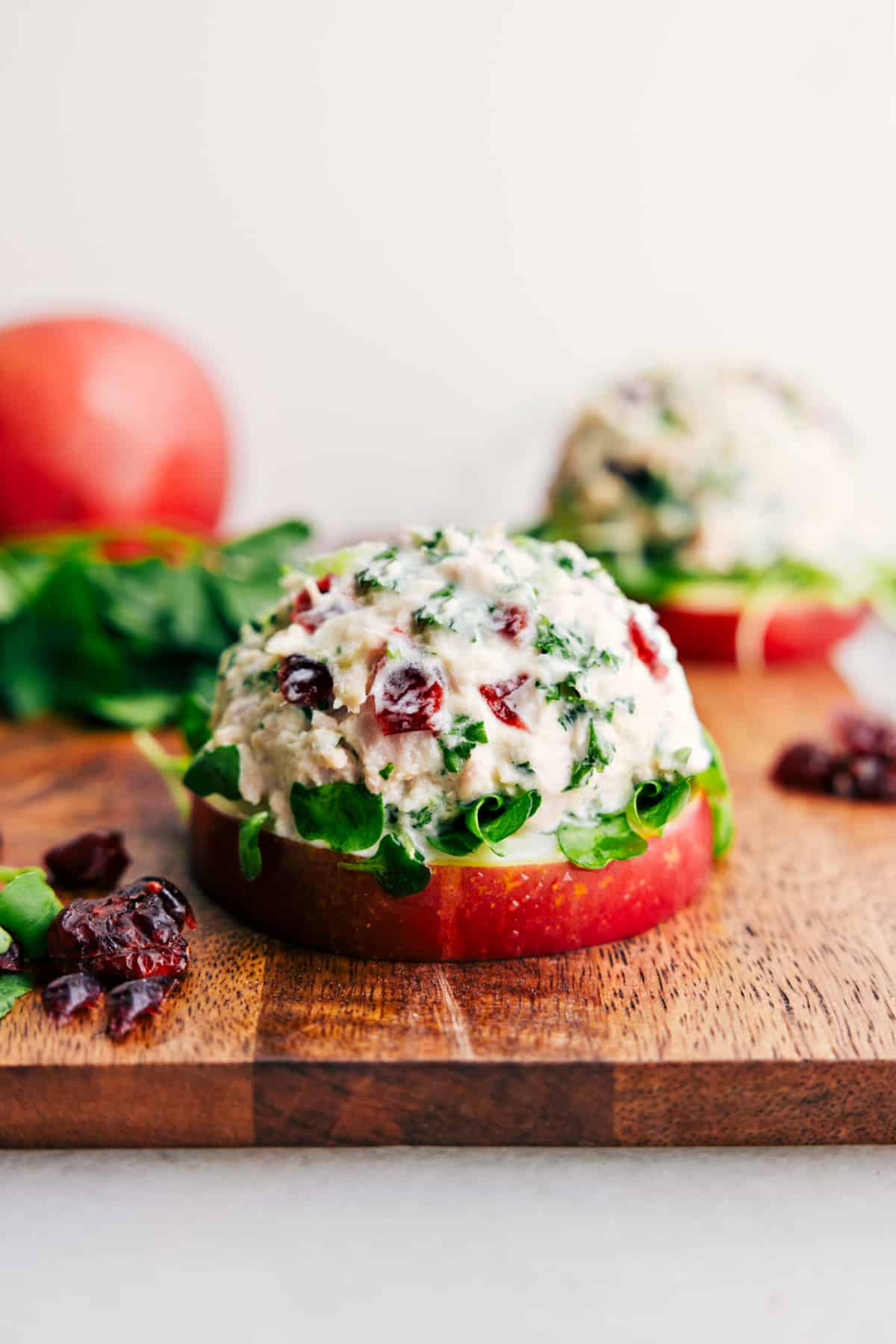 Easy Tuna Salad stacks on microgreens and an apple slice for a yummy, low-carb lunch.