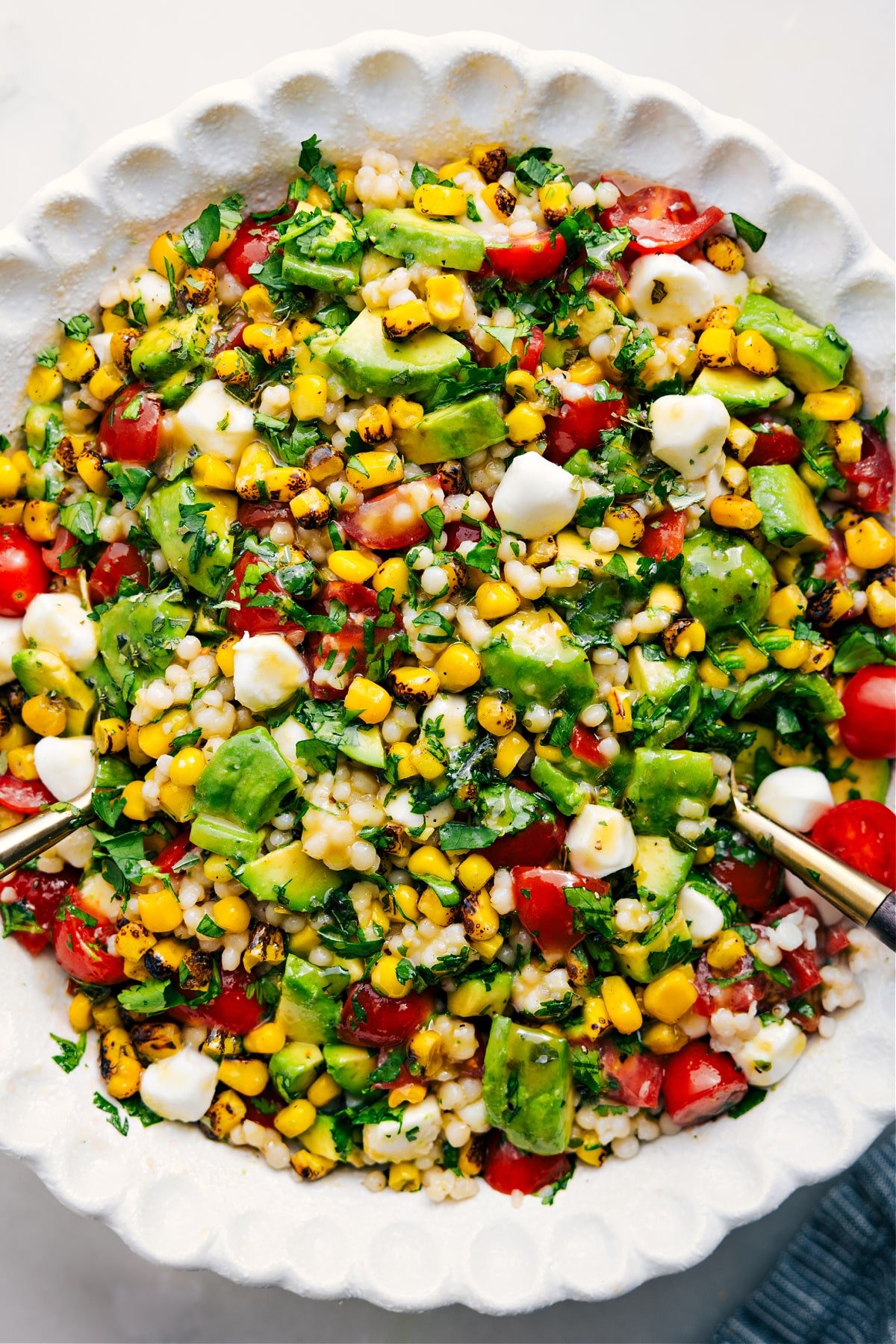 A big, delicious, and flavorful salad in a bowl—dressed and ready to enjoy.