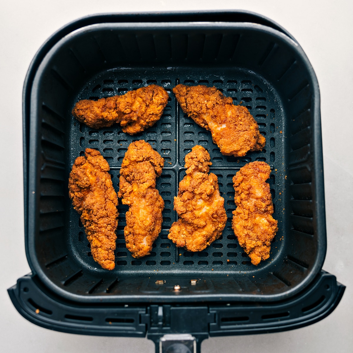 The crispy chicken freshly air fried and ready to be added to the buffalo wraps.