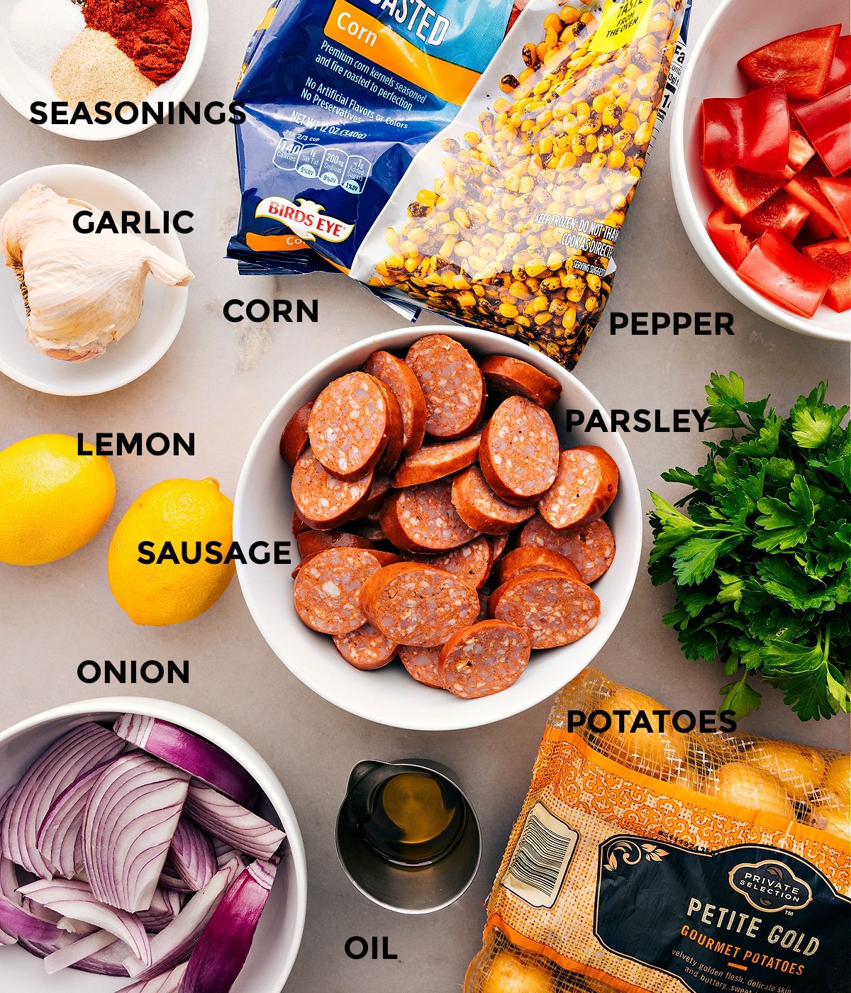 This recipe has everything prepped for easy assembly: meat, veggies, lemon, seasonings, and oil.