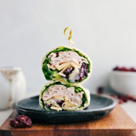 Turkey Cranberry Wrap on a plate stacked on top of each other.