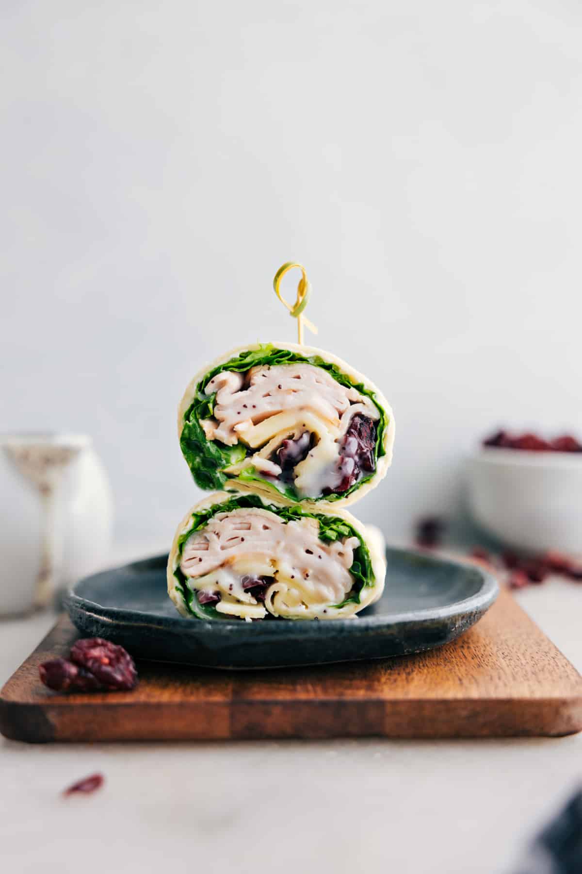 Turkey Cranberry Wrap on a plate stacked on top of each other.