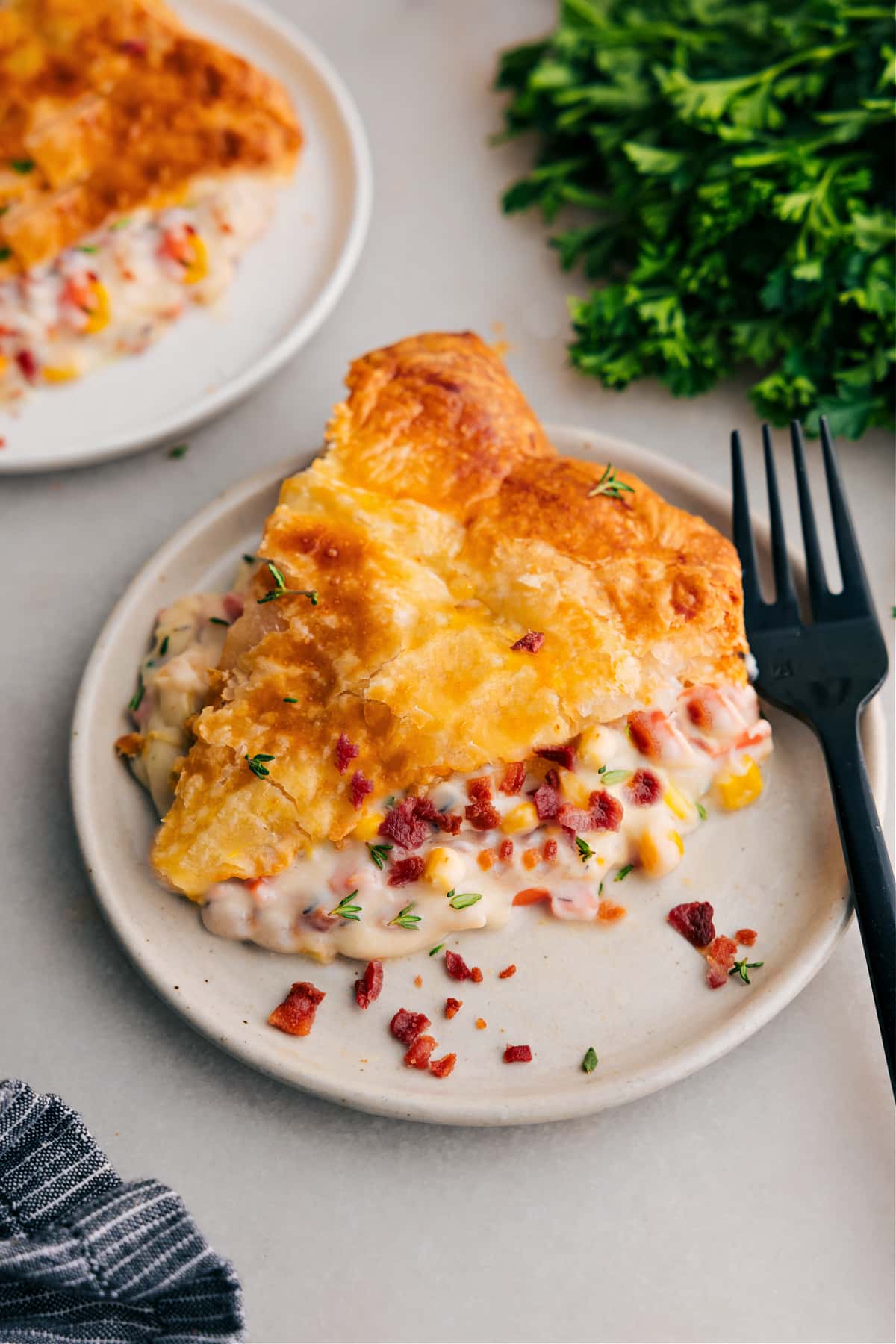 Corn Chowder Pot Pie slice on a plate, ready to enjoy.