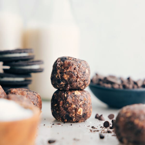 Cookies & Cream Energy Bites stacked on top of each other, ready to be enjoyed.