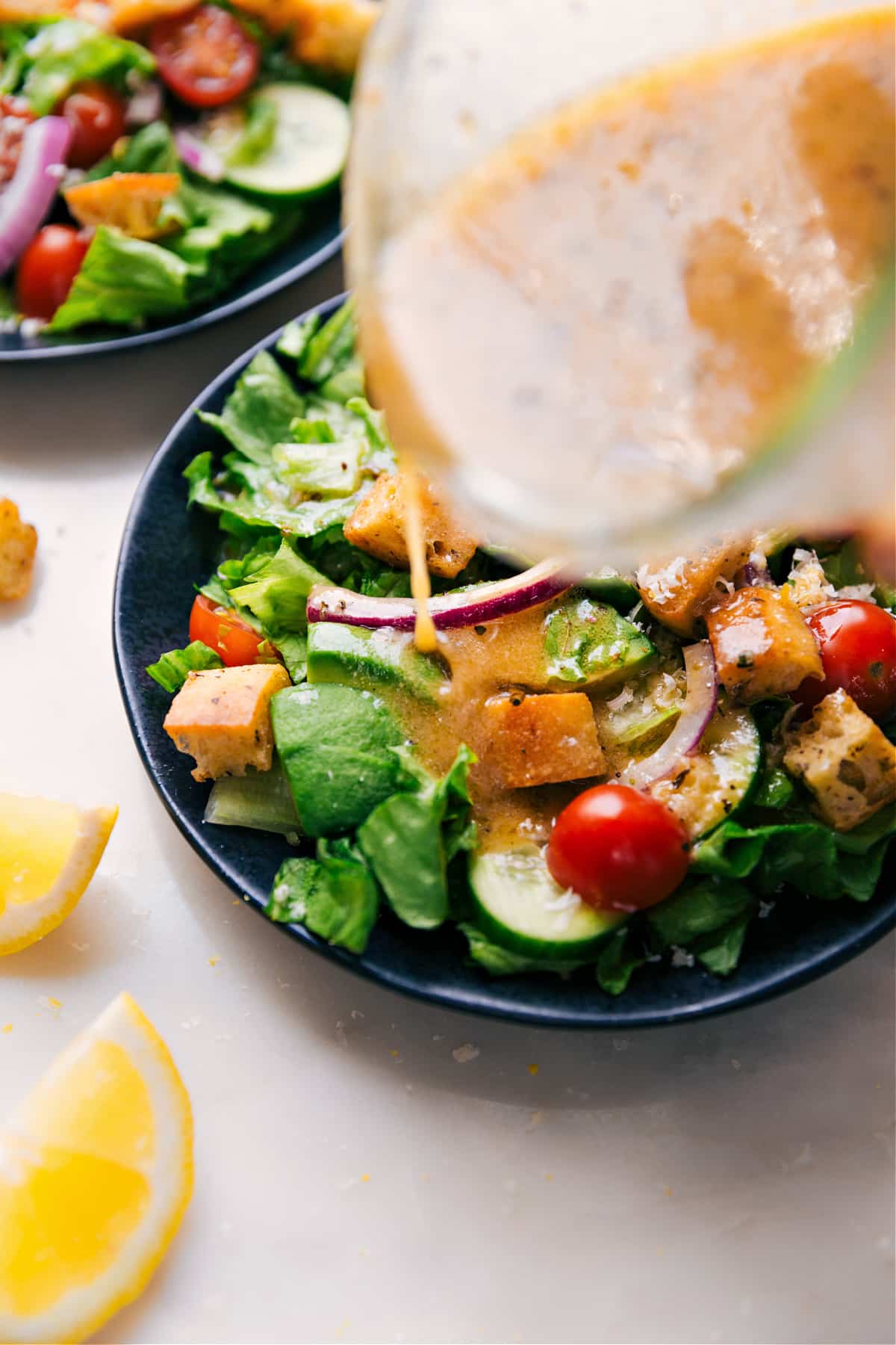 Dressing poured over a salad.