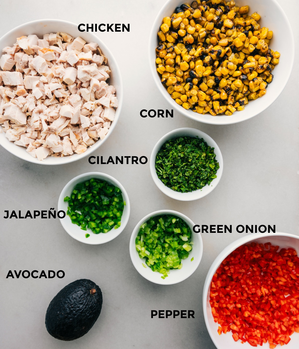 The ingredients for Mexican street corn chicken salad prepped out for easy assembly.