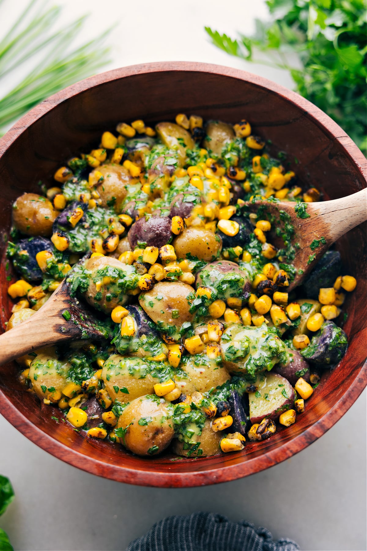 No Mayo Potato Salad in a bowl tossed together and ready to be enjoyed.