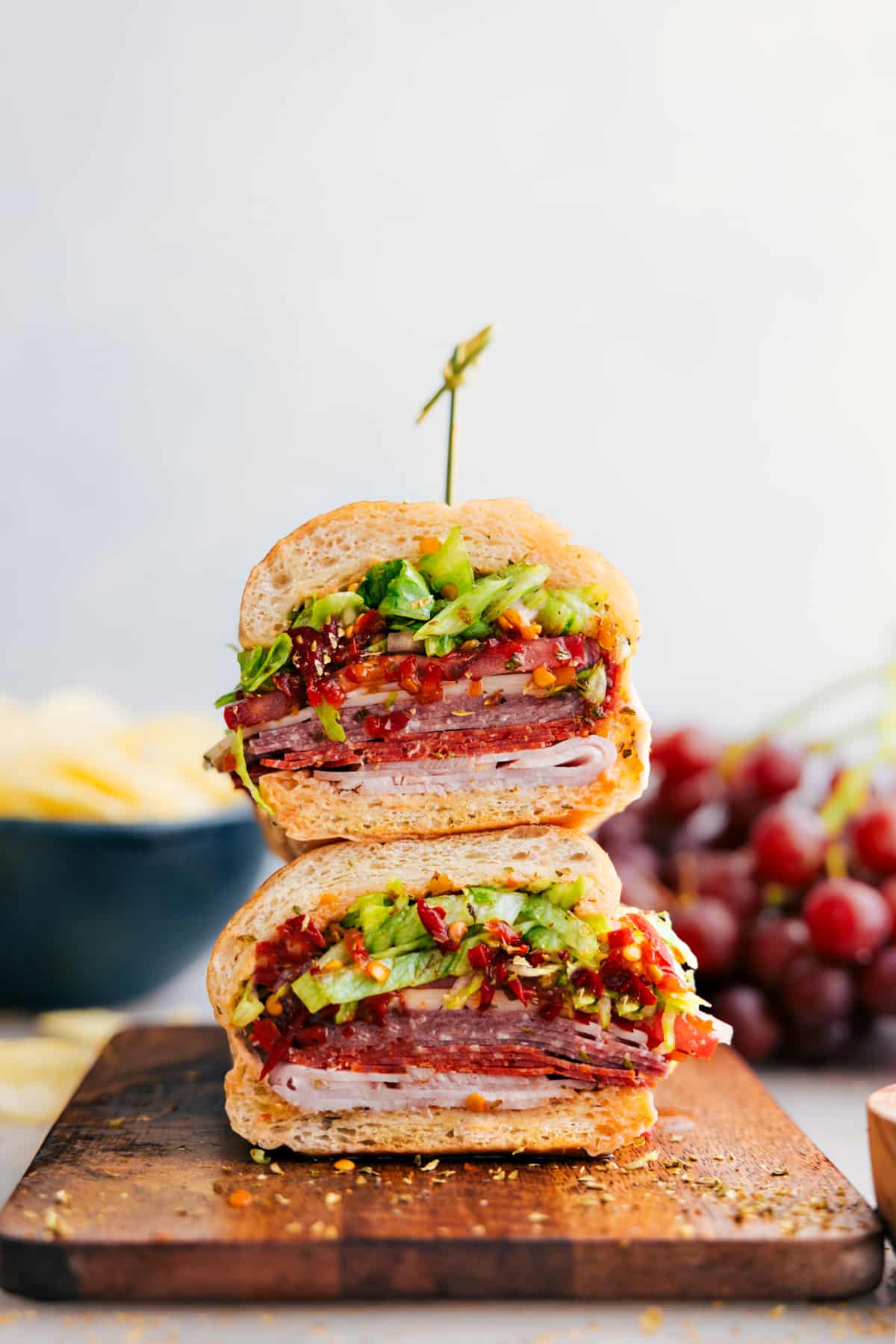 Italian Hoagies stacked on top of each other ready to enjoy.