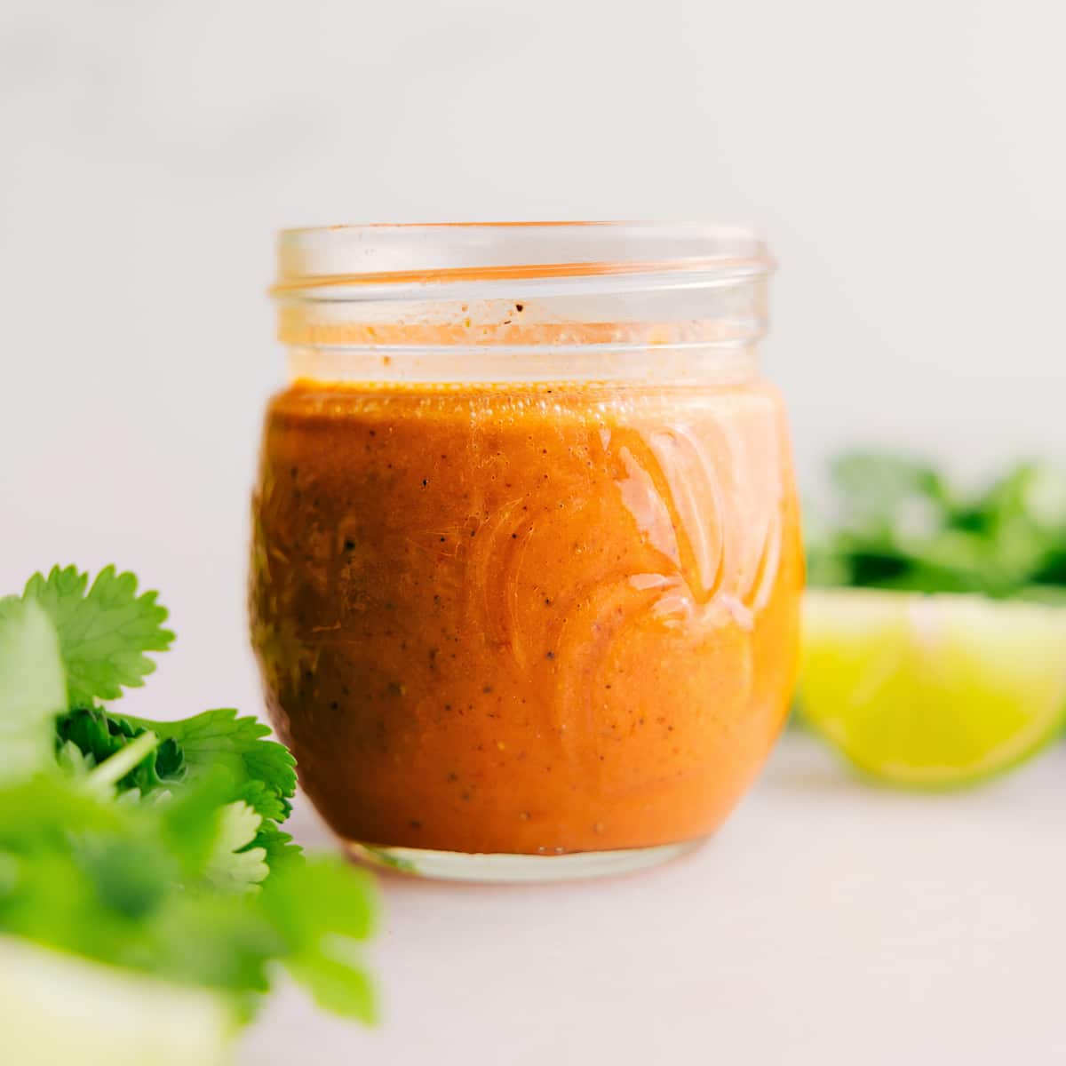 Chipotle Vinaigrette in a glass jar, showing its rich, smooth texture.