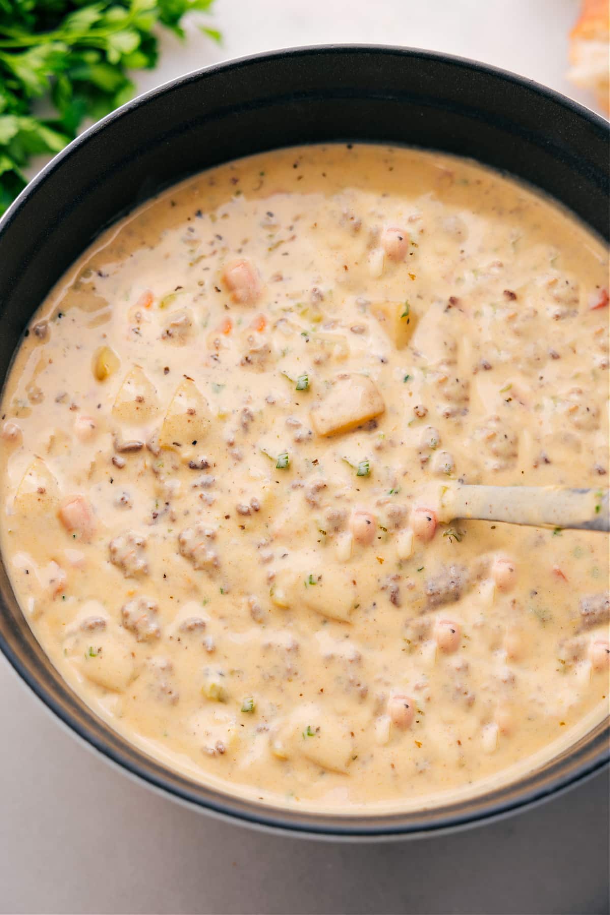 Serving up Cheeseburger Soup from the pot.