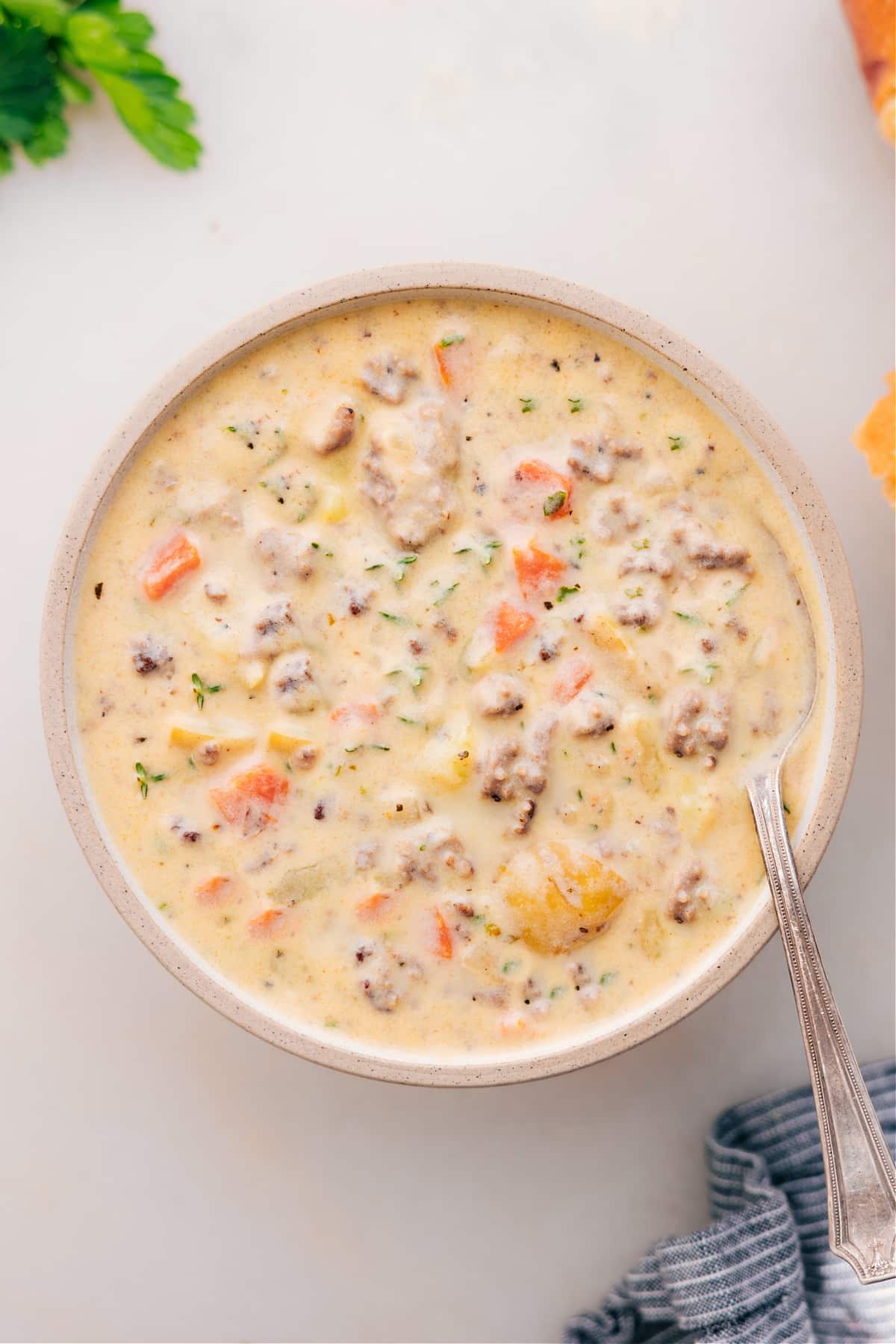 Enjoying this Cheeseburger Soup recipe in a bowl.