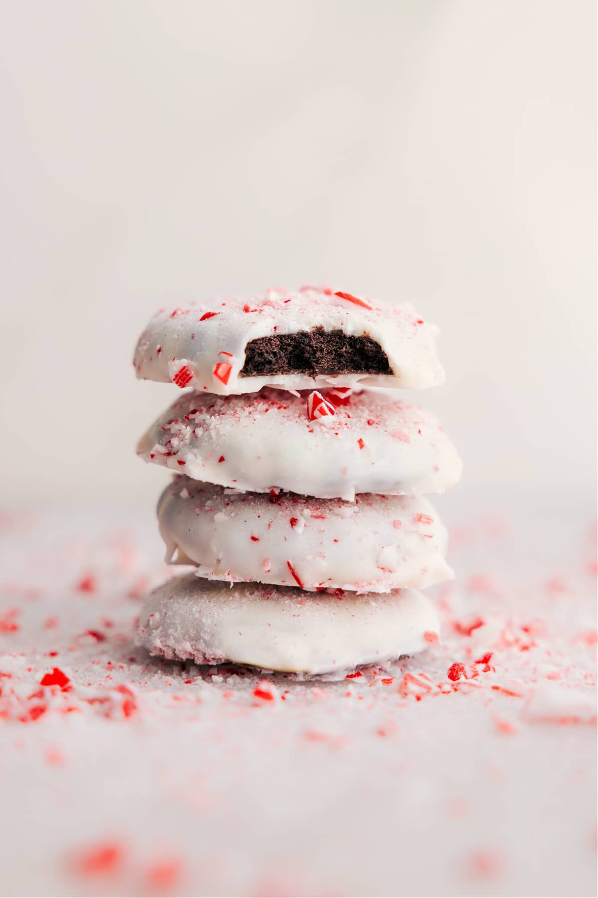 Stacked Peppermint Cookies with a bite missing from one.