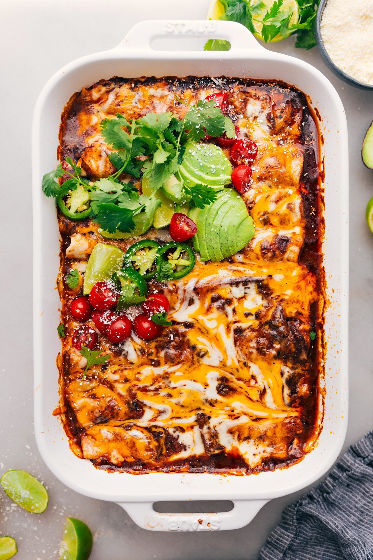 Crockpot or instant pot Shredded Beef Enchiladas fresh out of the oven with toppings.