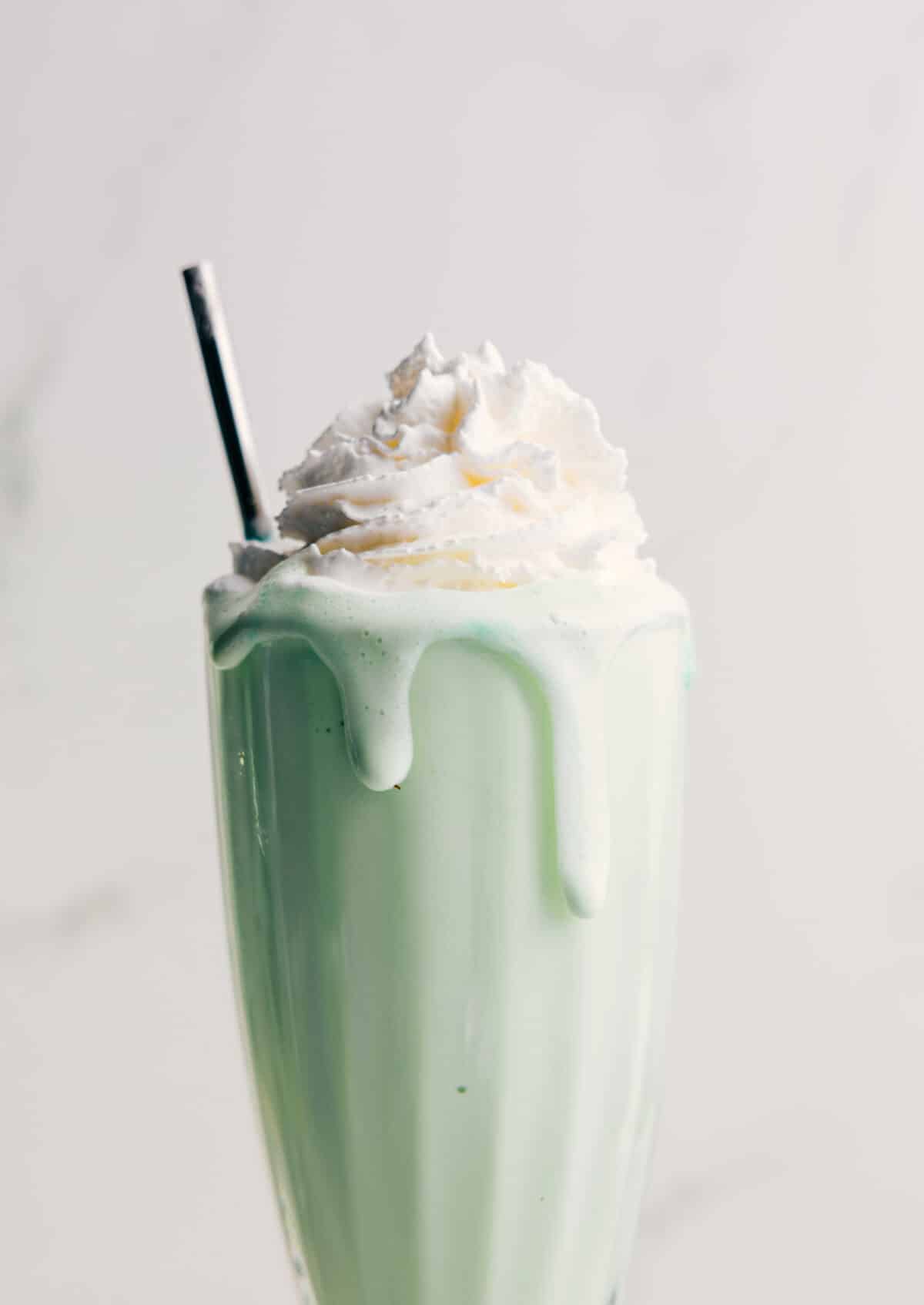 Shamrock Shake topped with fresh whipped cream.