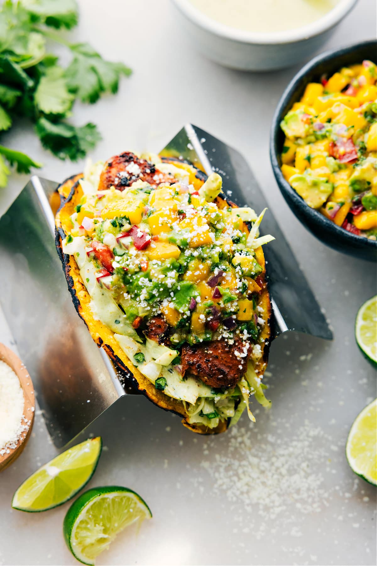 A Salmon Taco prepped out with all the toppings and ready to be enjoyed.