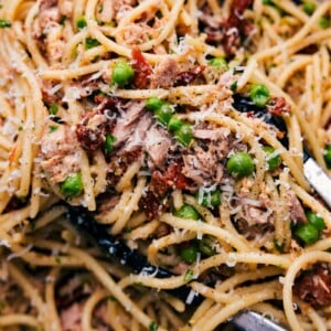 A bowl of healthy tuna pasta, freshly prepared and topped with grated cheese, inviting a savory and nutritious meal experience.