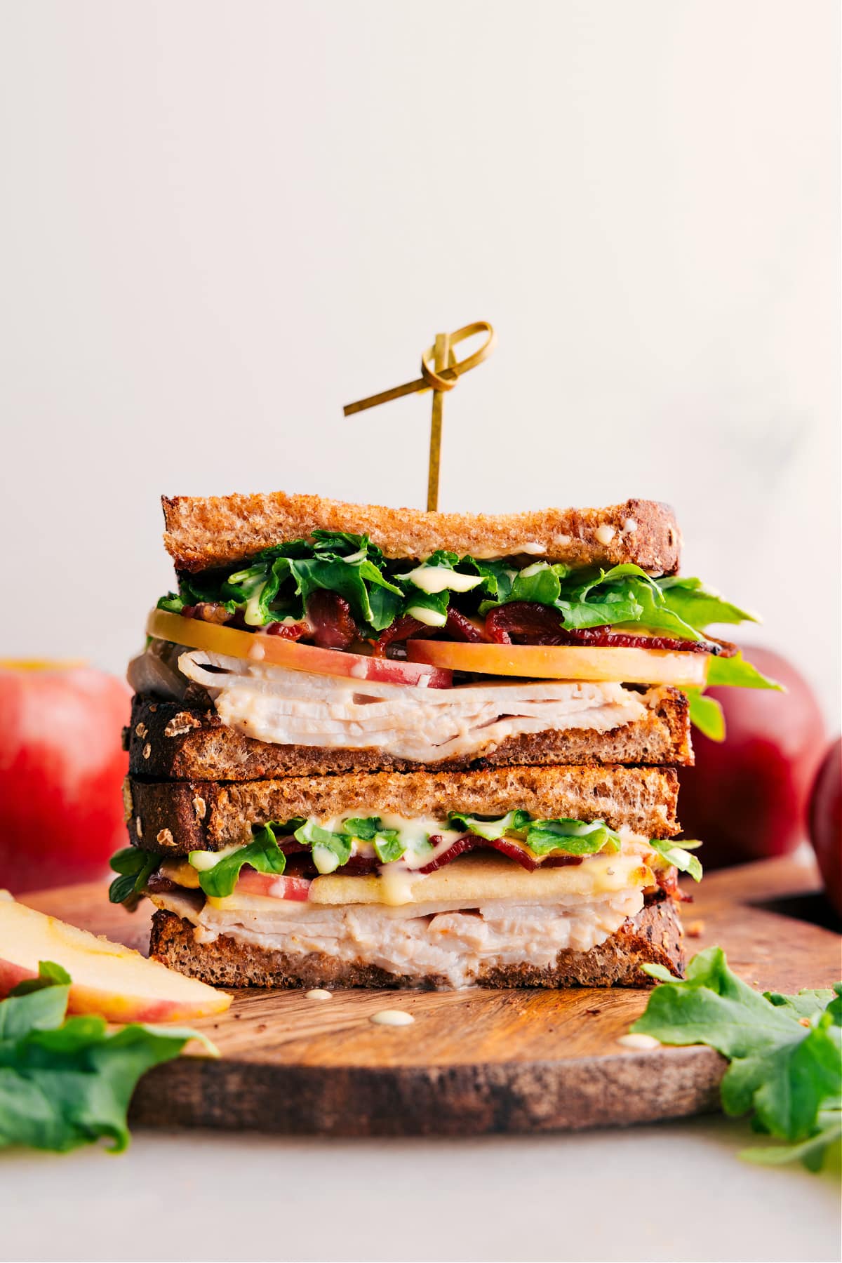 The best turkey sandwich, cut in half and stacked on top of each other, is ready to enjoy.