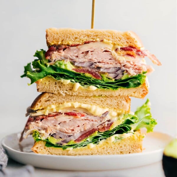 A thick and flavor-packed turkey bacon avocado sandwich made with delicious Thanksgiving leftovers, fresh vegetables, and a savory sauce.