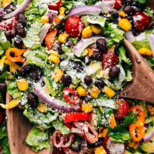 Mexican Salad being tossed with the dressing.