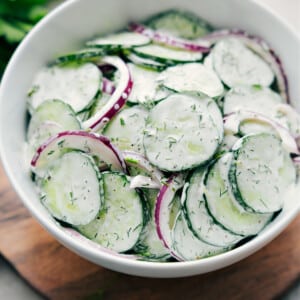 Creamy Cucumber Salad recipe in a bowl ready to be enjoyed.