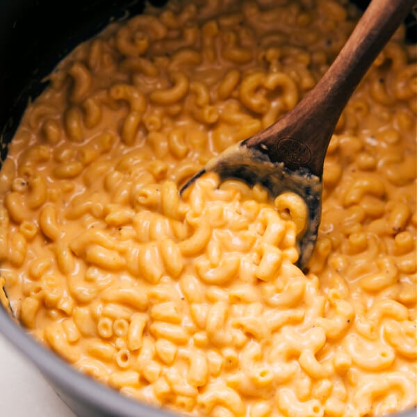 The dish in a pot with a spoon scooping some out.