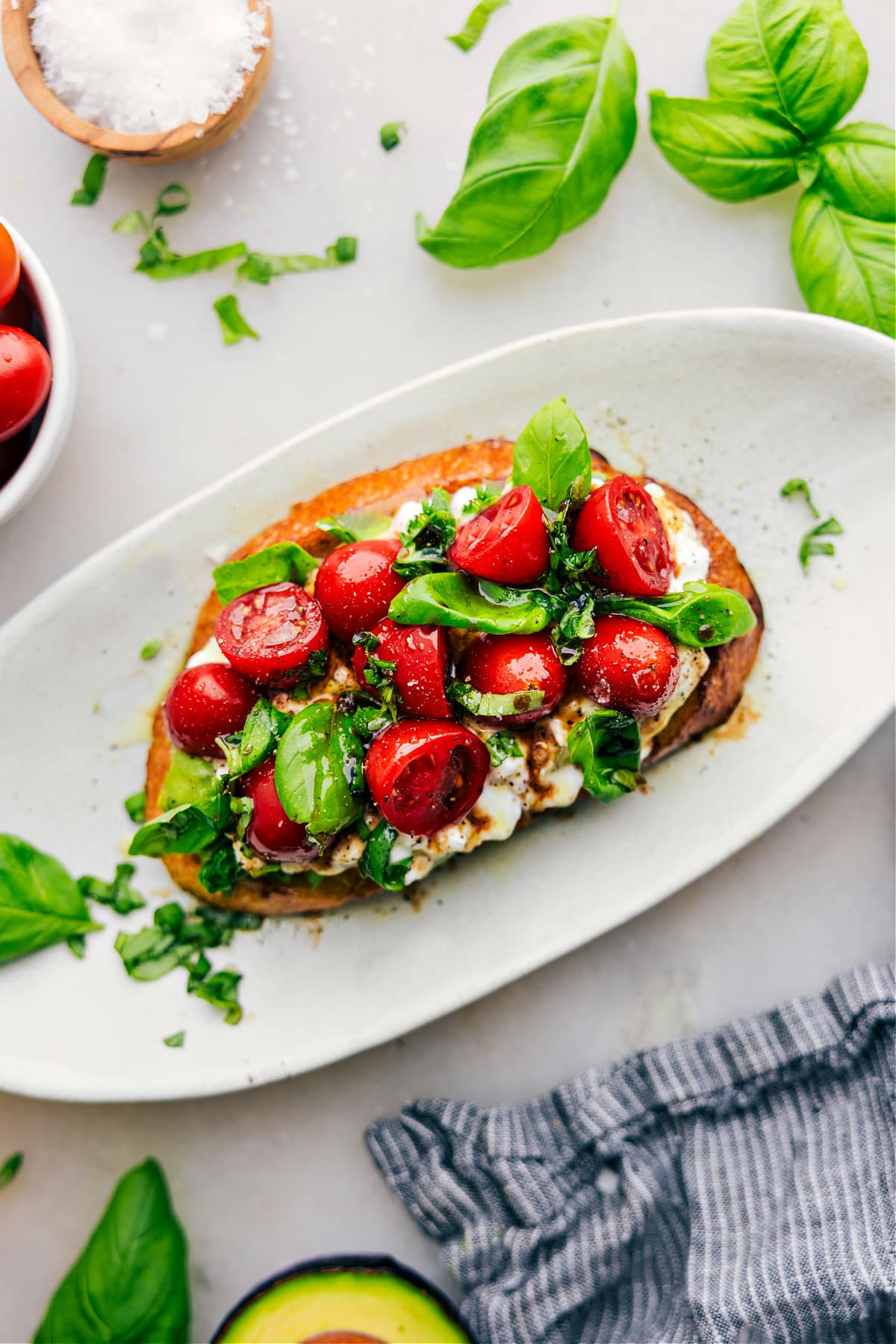 Cottage Cheese Toast on a plate with fresh basil and balsamic.