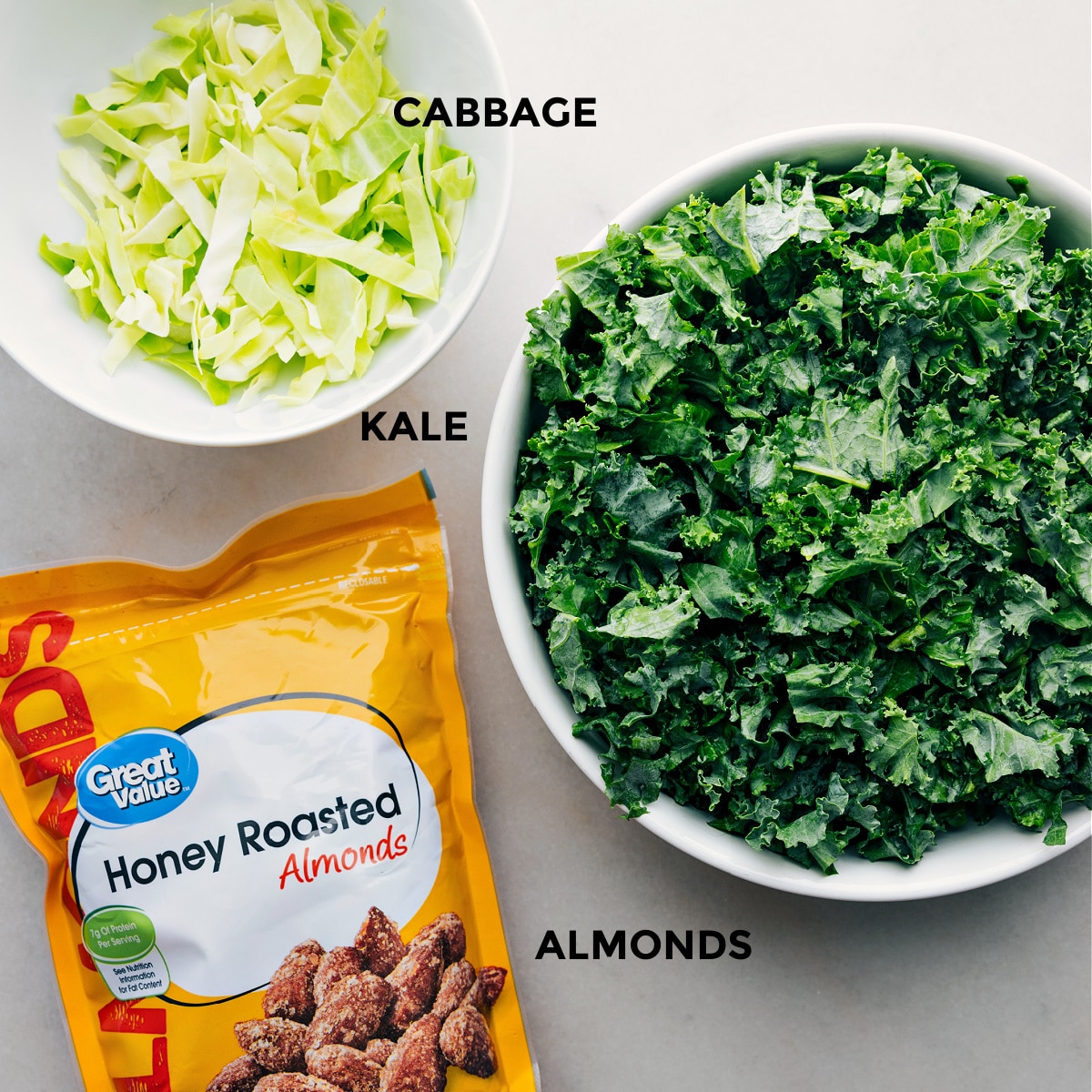 All the three ingredients including cabbage, kale, and almonds prepped out for easy assembly.