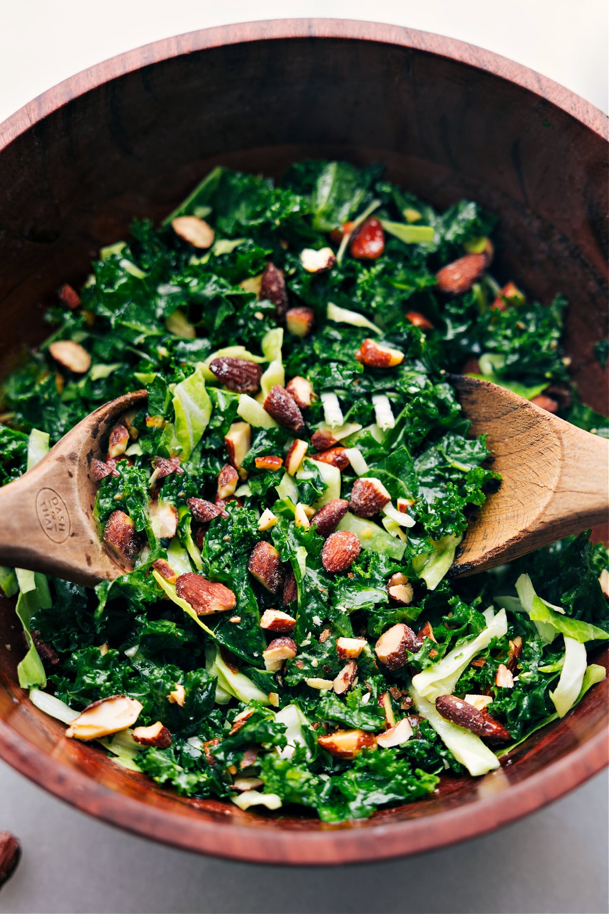 The tossed together and ready to serve Chick-Fil-A Kale Salad in a bowl.