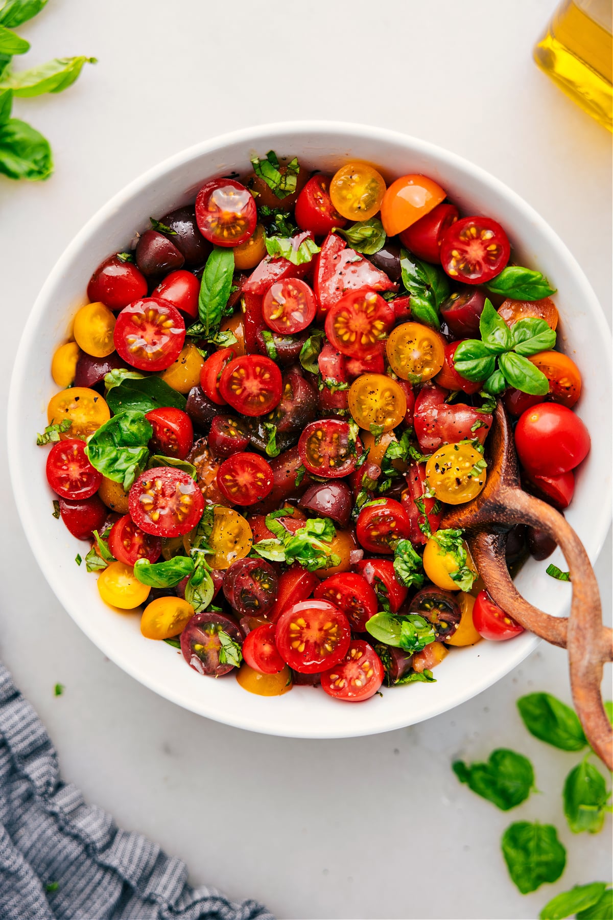 Tomato Salad in a bowl with fresh basil.