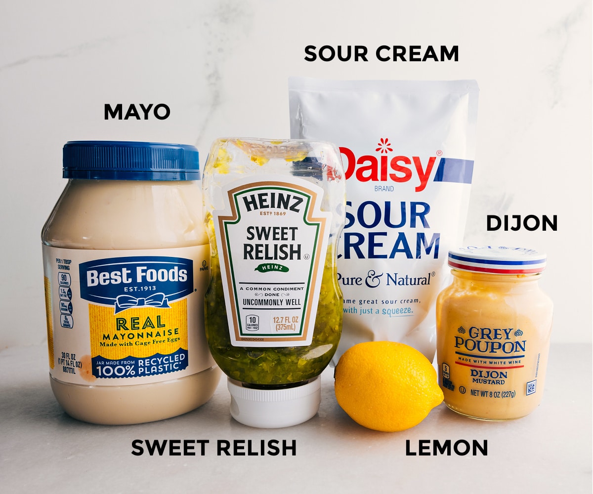 Prep the sauce ingredients for easy assembly: mayo, relish, mustard, lemon, and sour cream.