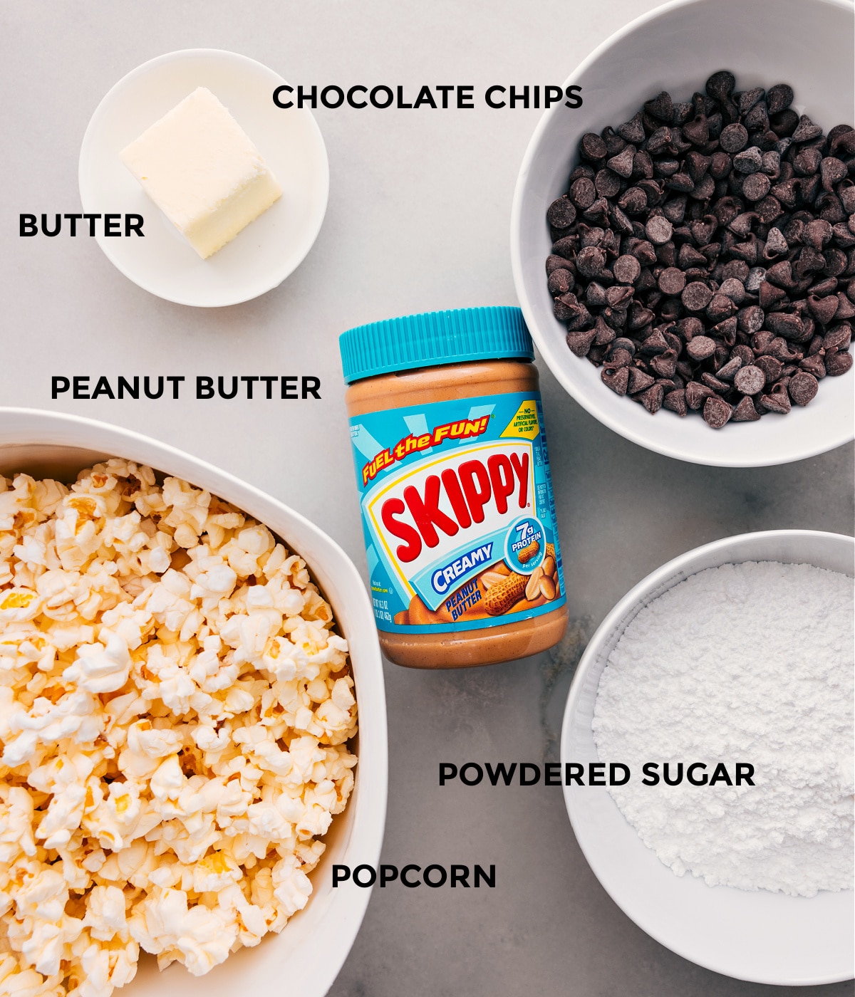 This recipe includes chocolate chips, popcorn, peanut butter, powdered sugar, and butter.