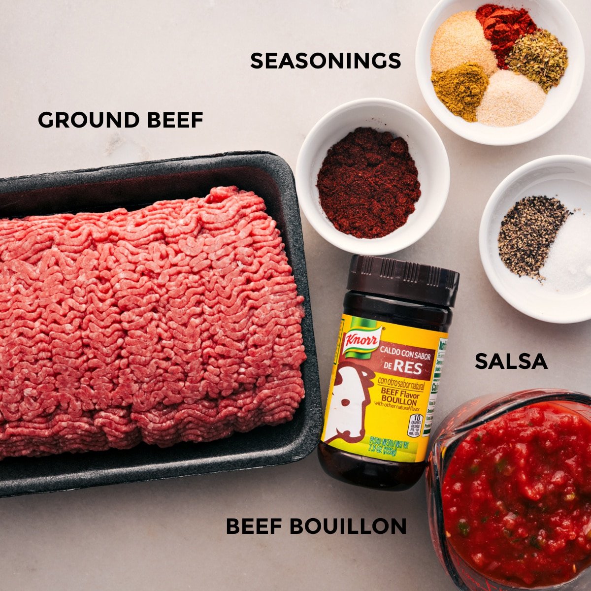 All the ingredients for this recipe prepped for easy assembly, including ground beef, seasonings, and salsa.