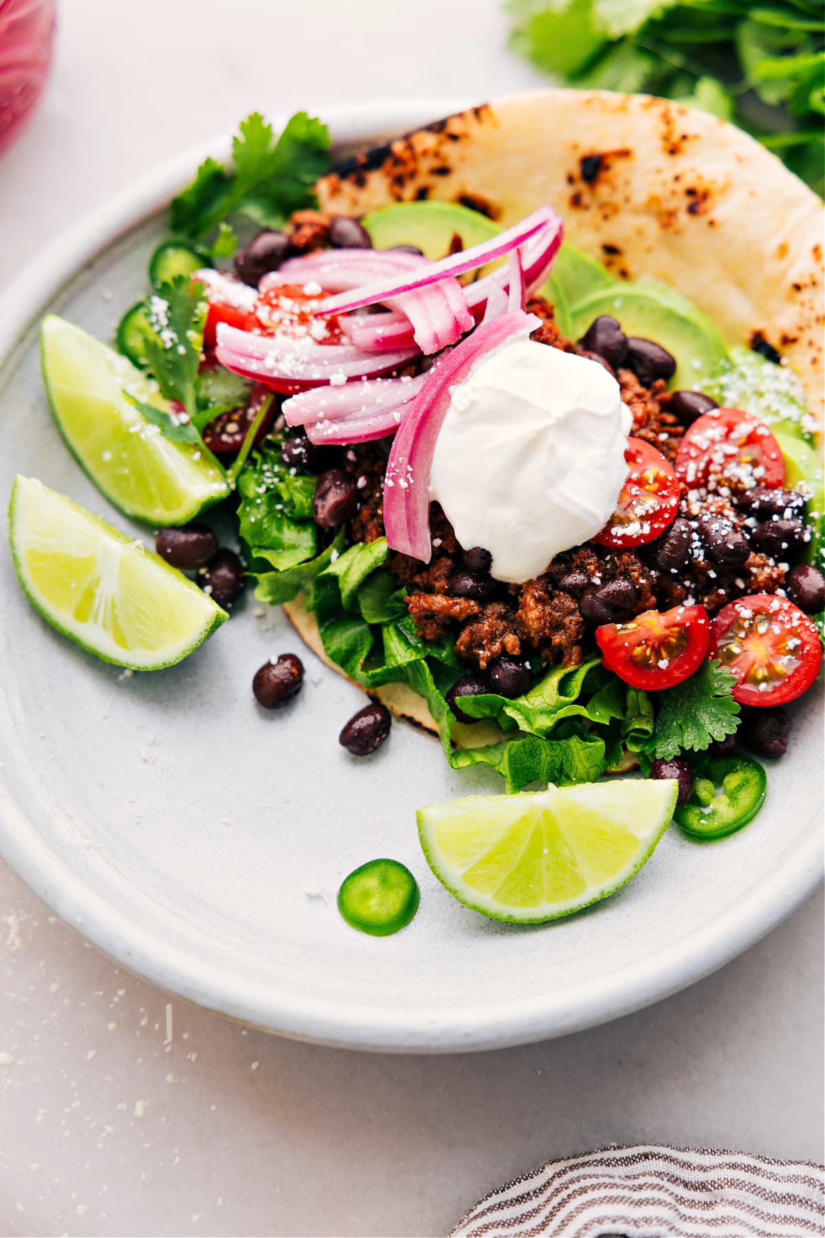 An assembled taco with the ground beef in it from the slow cooker.