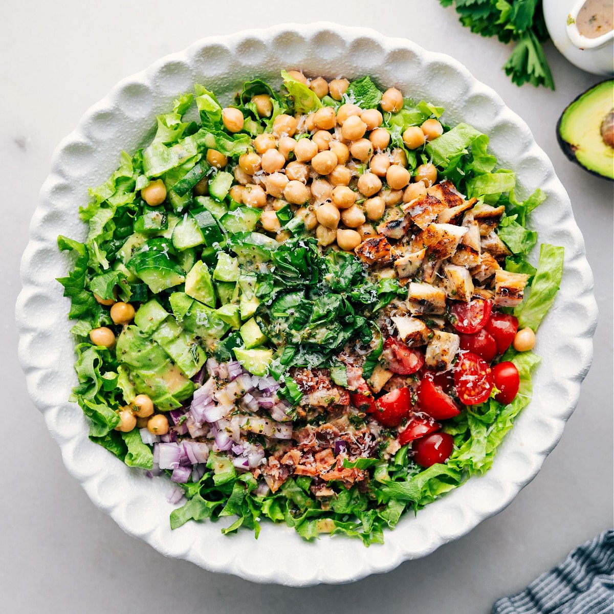 All the ingredients added to a bowl and it all dressed with dressing for this delicious high protein dish.