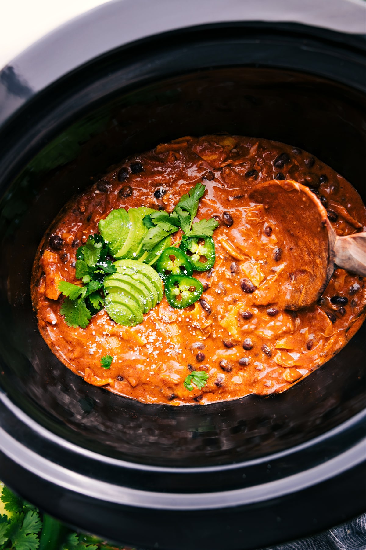 Crockpot Chicken Enchilada Casserole cooks in the slow cooker.