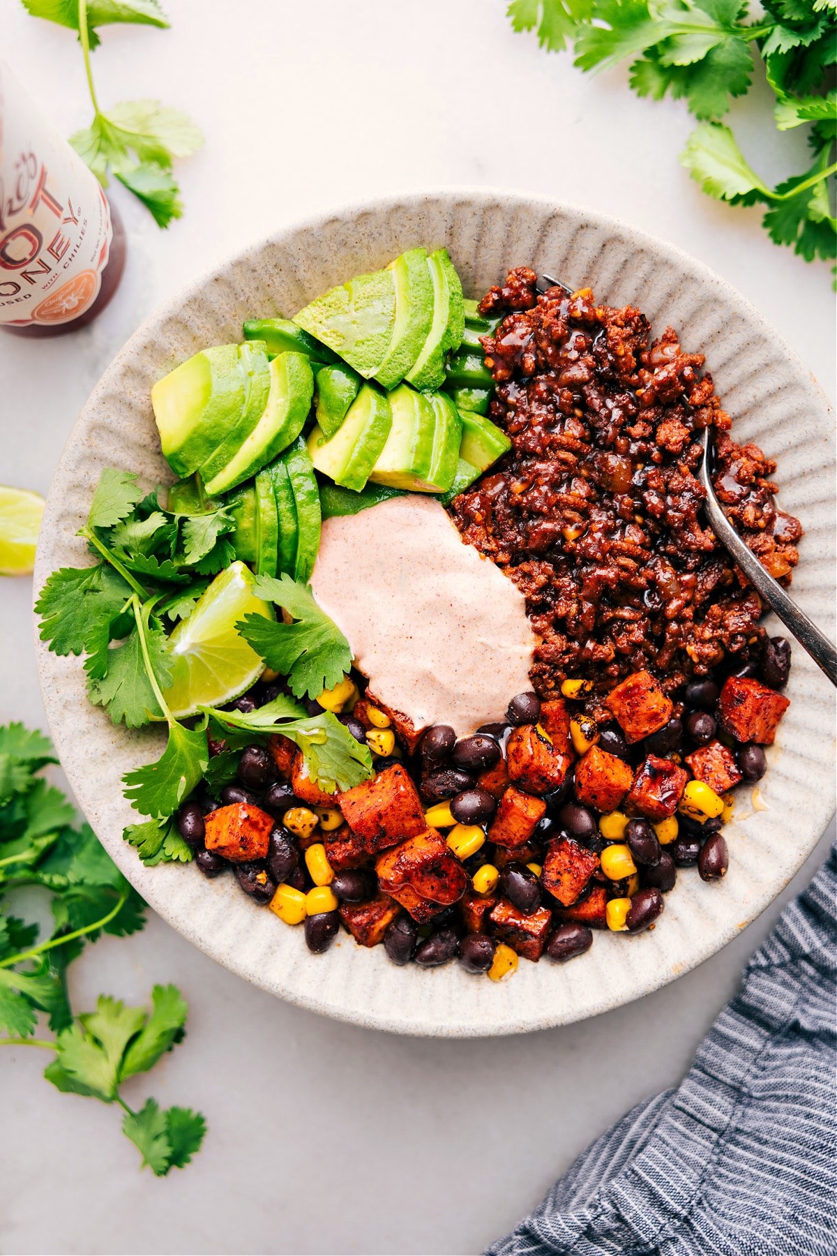 Ground Beef Taco Bowl with sauce, ready for you to enjoy.